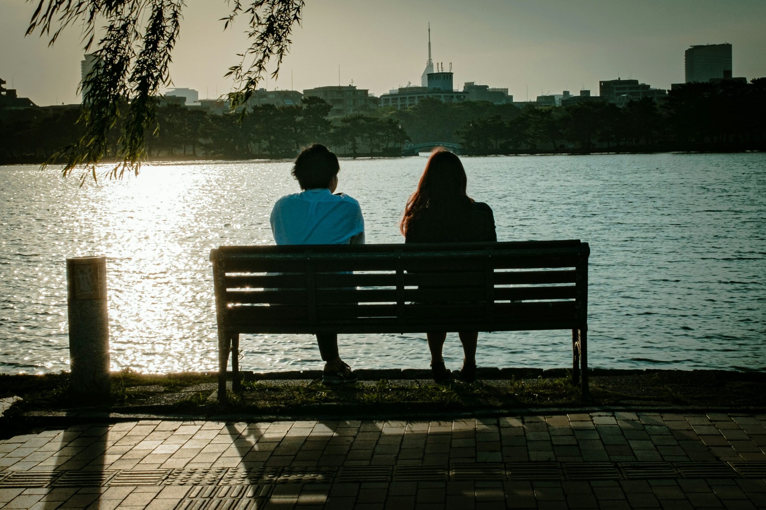 Couple sitting on park bench