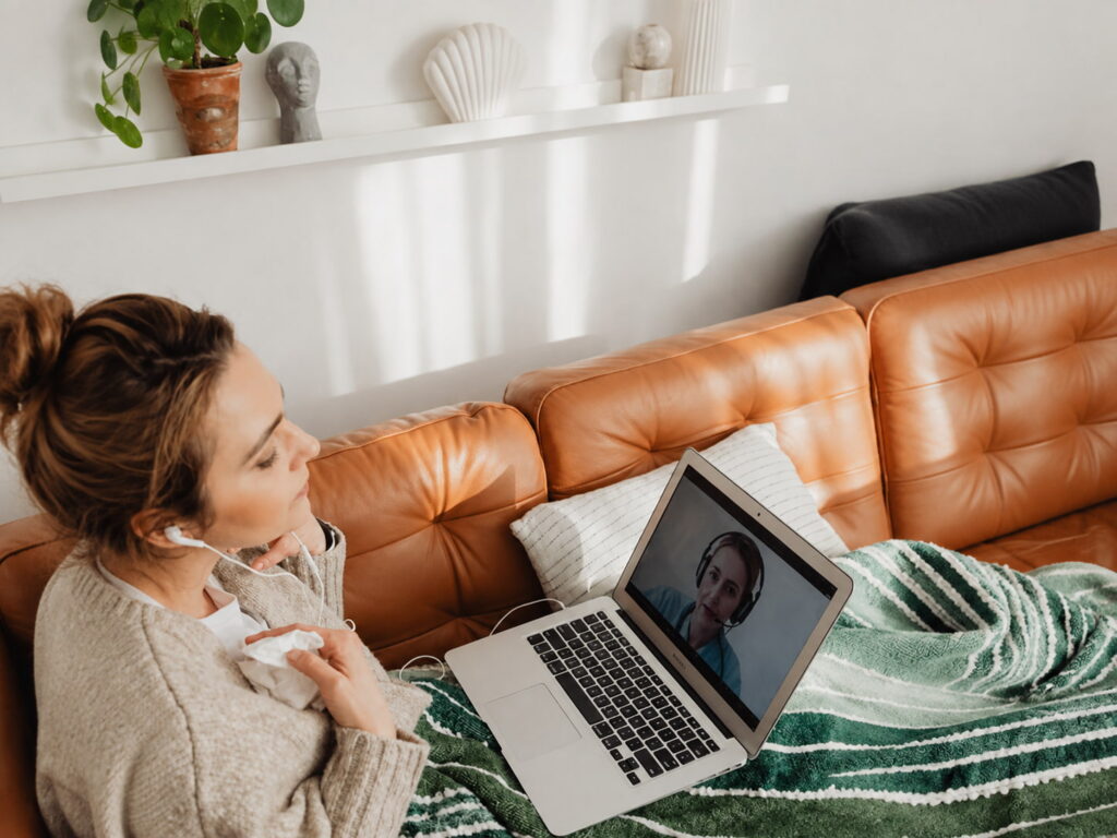 A telehealth therapy session on a laptop representing the Counseling Compact interstate licensure framework that governs online counseling services for Columbia Maryland and Howard County clients